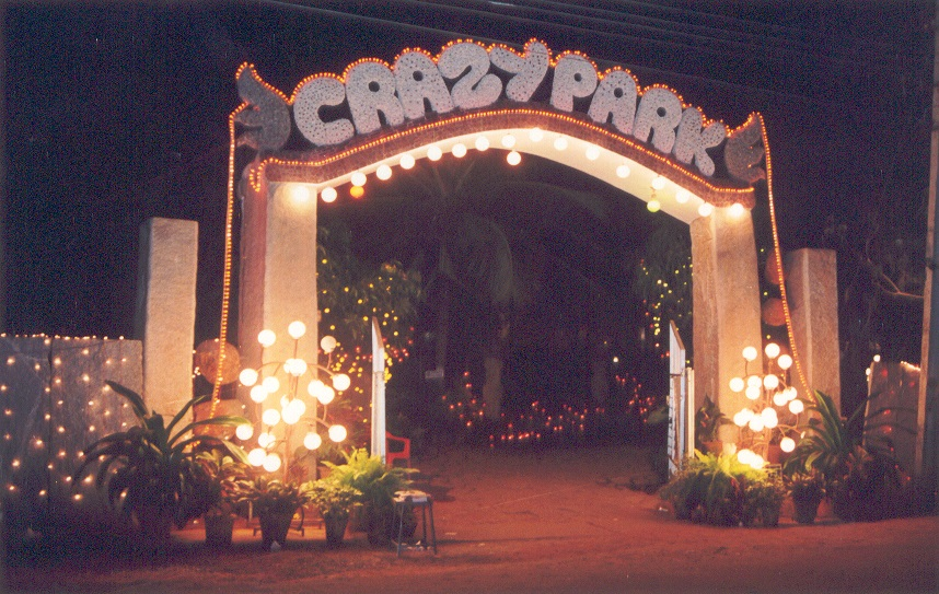 The illuminated Crazy Park entrance archway lit up at night